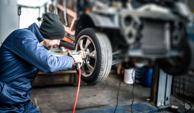 Mechanic replacing car wheel