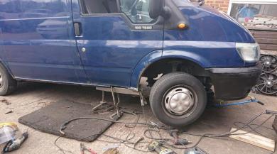 Welding being carried out on a blue van